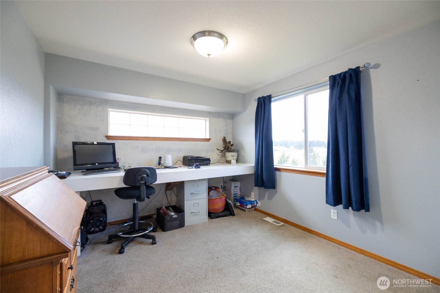 7332 183rd Avenue Southwest Rochester, WA 98579 - Photo 22 of 40 a view of a workspace with furniture and a window