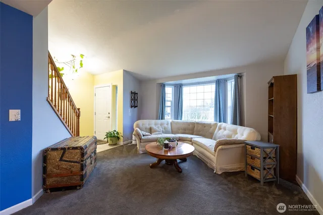 a bathroom with double vanity sinks a large mirror and a shower