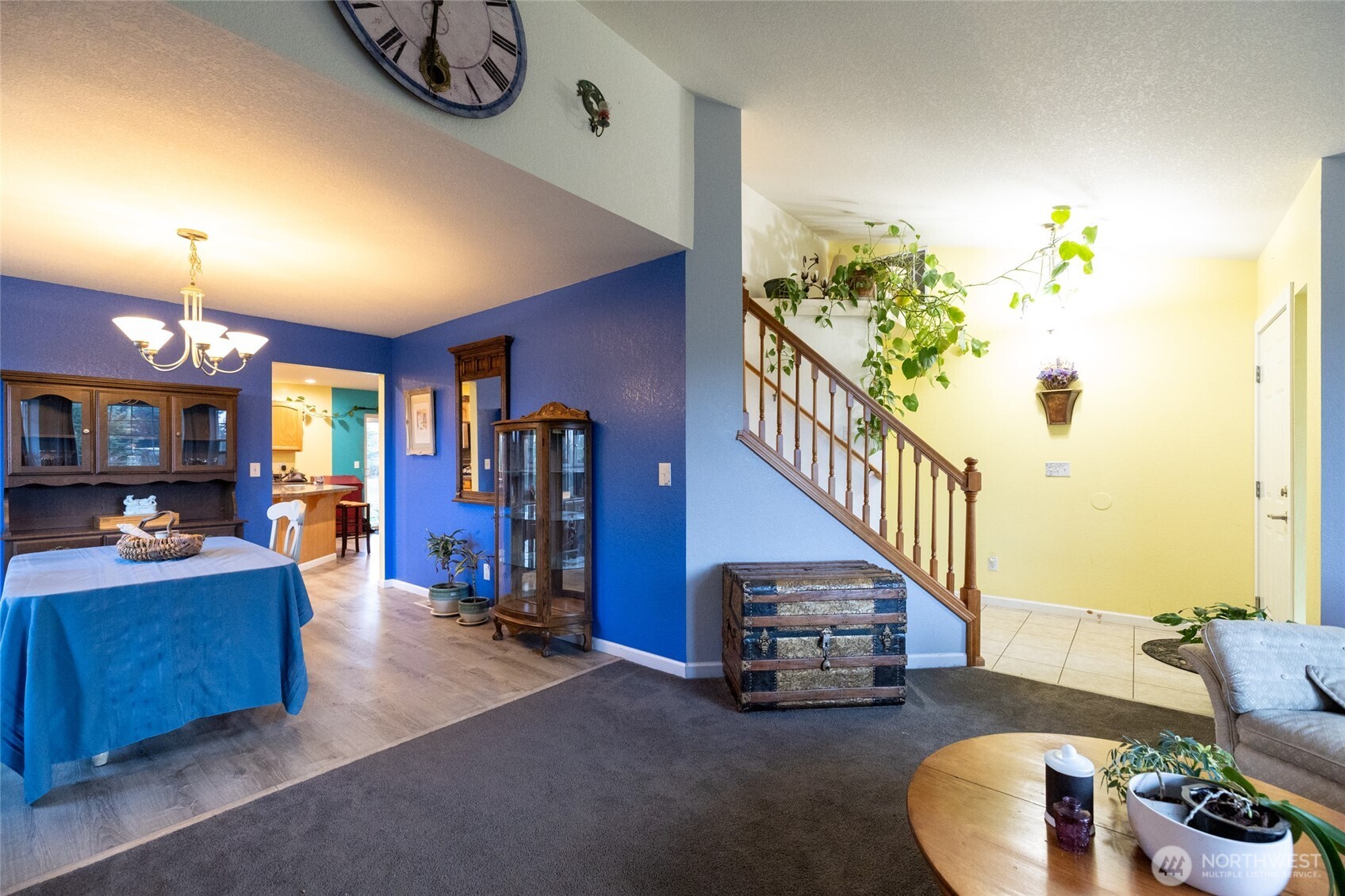 7332 183rd Avenue Southwest Rochester, WA 98579 - Photo 9 of 40 a living room with furniture and a chandelier