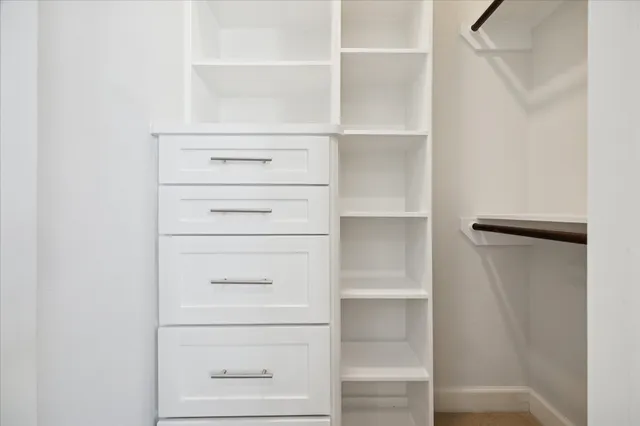 a view of an empty walk in closet