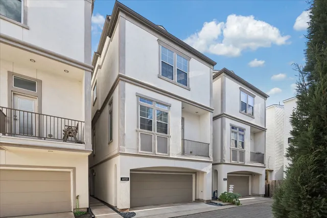 a front view of a building with many windows