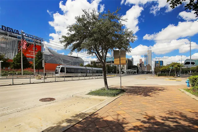 a swimming pool with yard and outdoor seating