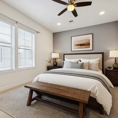 a bedroom with bed and window