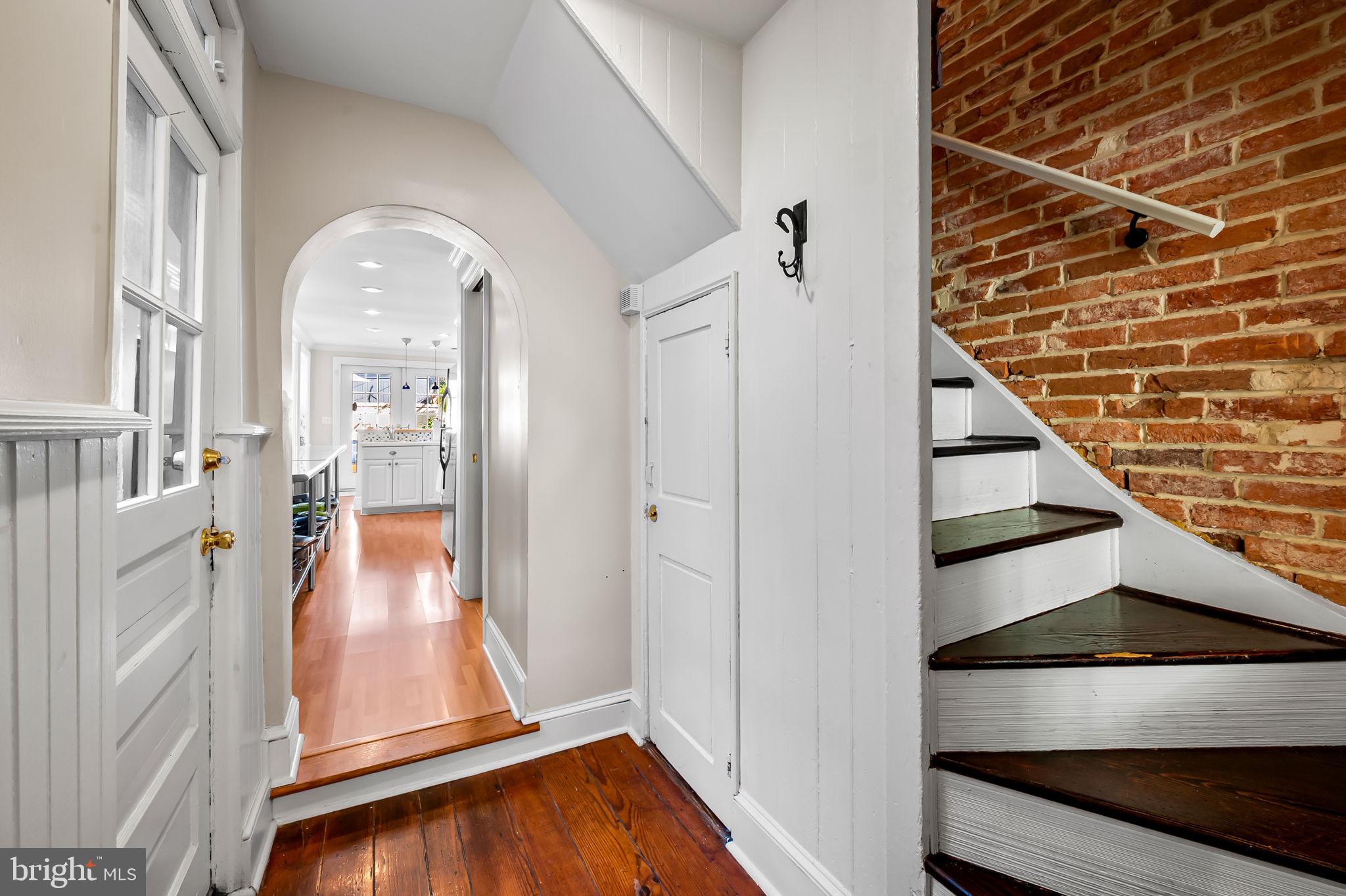 1908 Bank Street Baltimore, MD 21231 - Photo 12 of 37 a view of an entryway with wooden floor and door