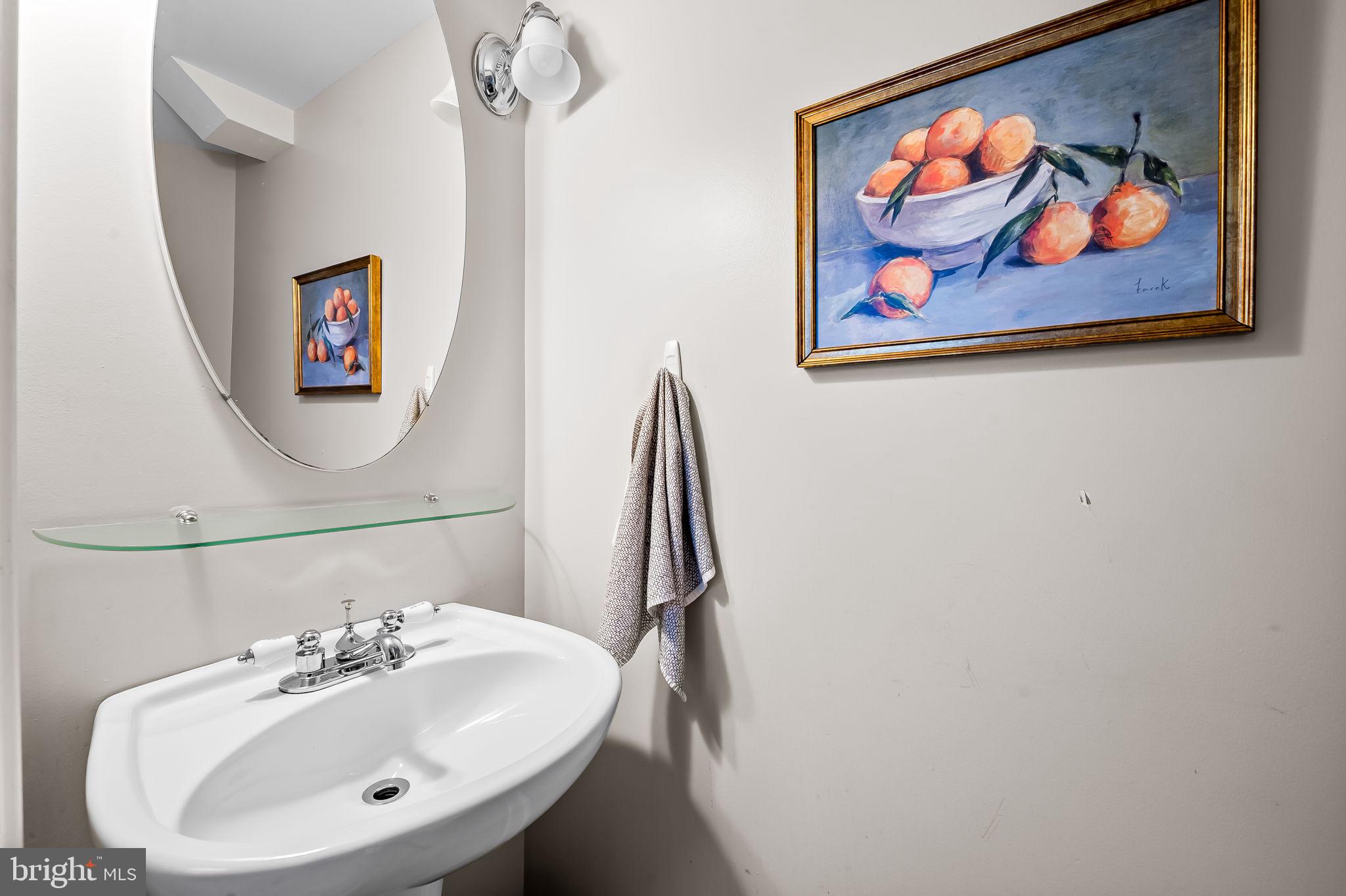 1908 Bank Street Baltimore, MD 21231 - Photo 19 of 37 a bathroom with a sink and a mirror