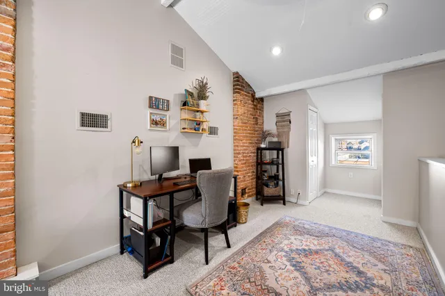 a workspace with furniture and window