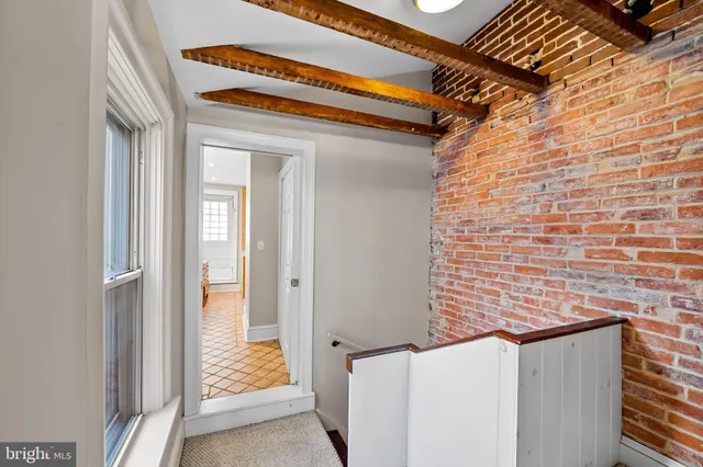 a view of a hallway with windows