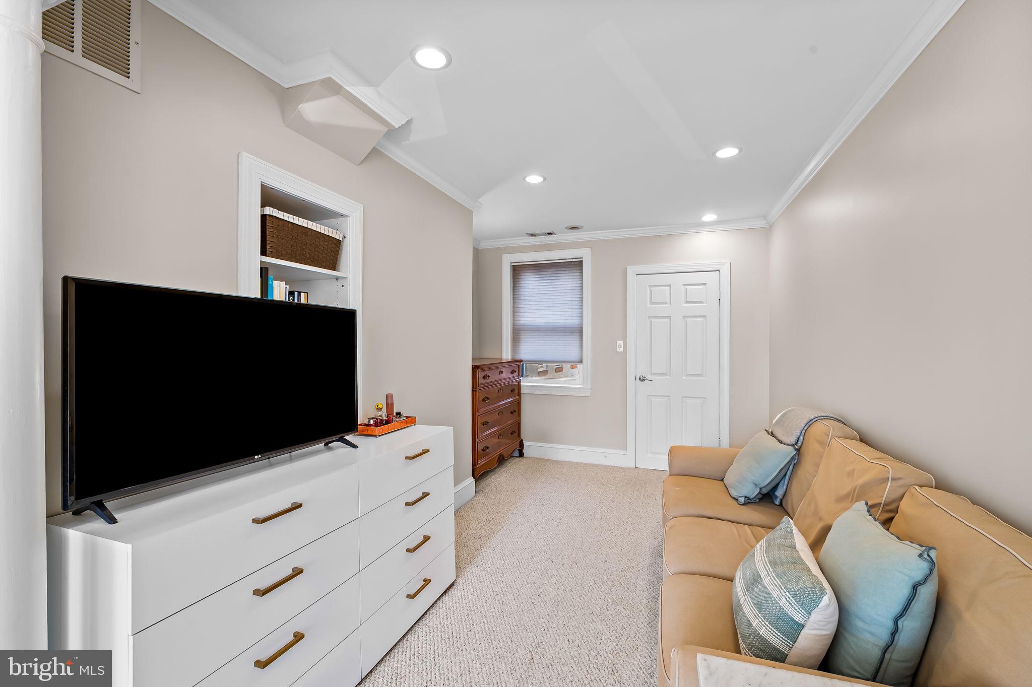 1908 Bank Street Baltimore, MD 21231 - Photo 32 of 37 a living room with furniture and a flat screen tv