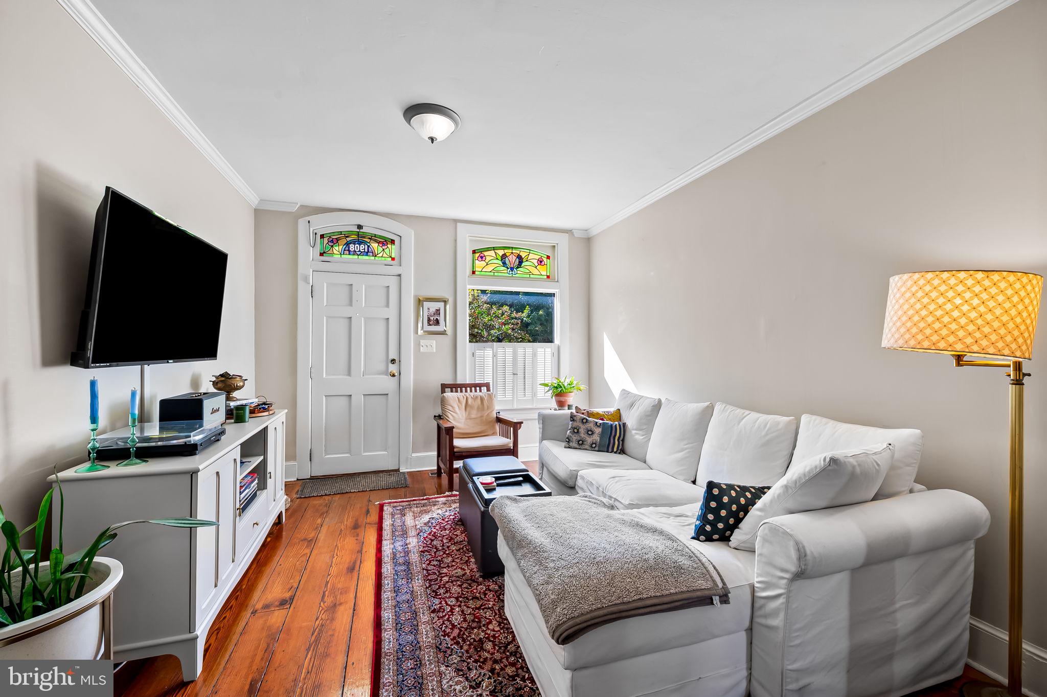 1908 Bank Street Baltimore, MD 21231 - Photo 5 of 37 a living room with furniture and a flat screen tv