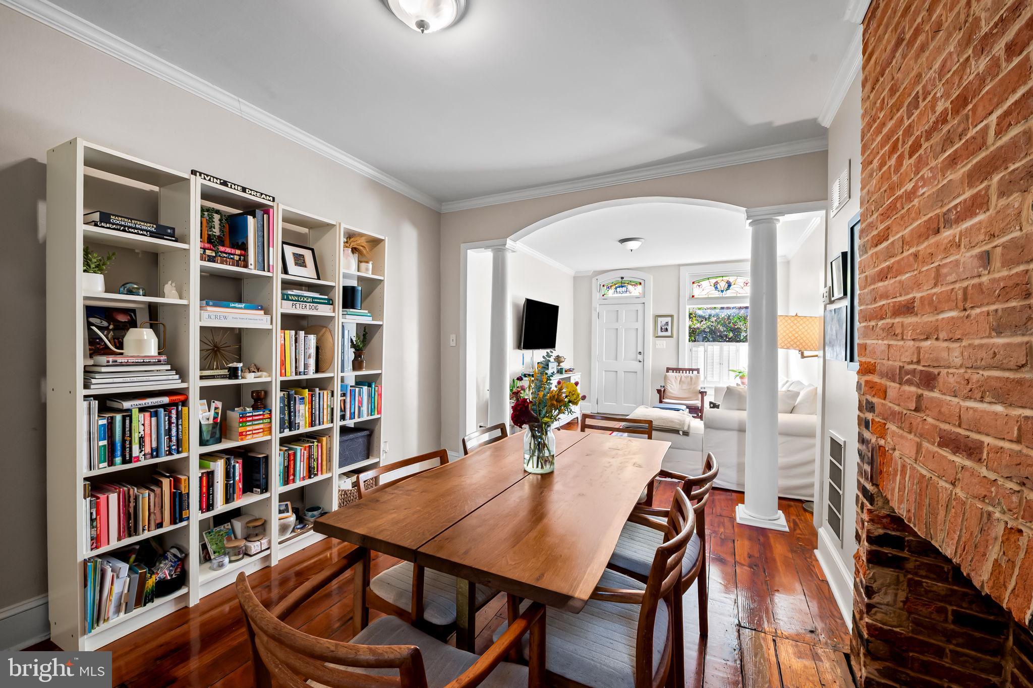 1908 Bank Street Baltimore, MD 21231 - Photo 10 of 37 a view of a workspace with furniture and a bookshelf