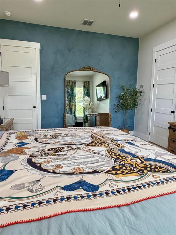 151 Gopher Road Weatherford, TX 76088 - Photo 9 of 22 a bedroom with a bed and a mirror