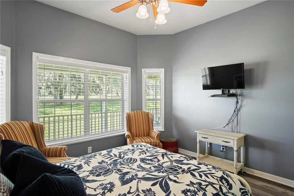 9045 Lake Hatchineha Road Kissimmee, FL 34759 - Photo 31 of 47 a bedroom with a bed and a television