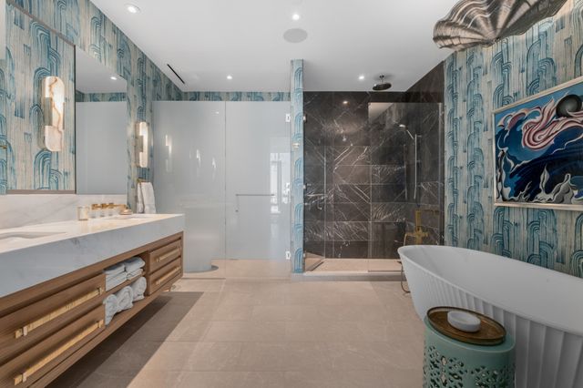 a bathroom with a double vanity sink and a mirror