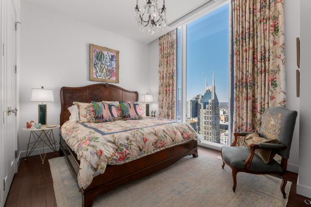 a bathroom with a sink toilet double vanity and shower