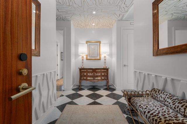 a living room with furniture a window and a table