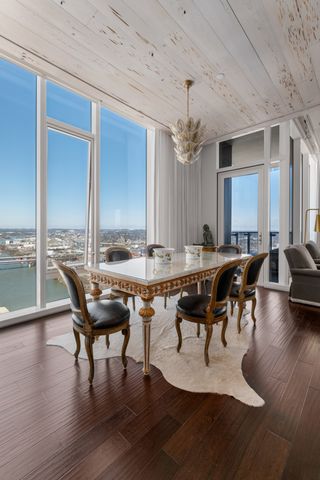 a view of a dining room with furniture window and wooden floor