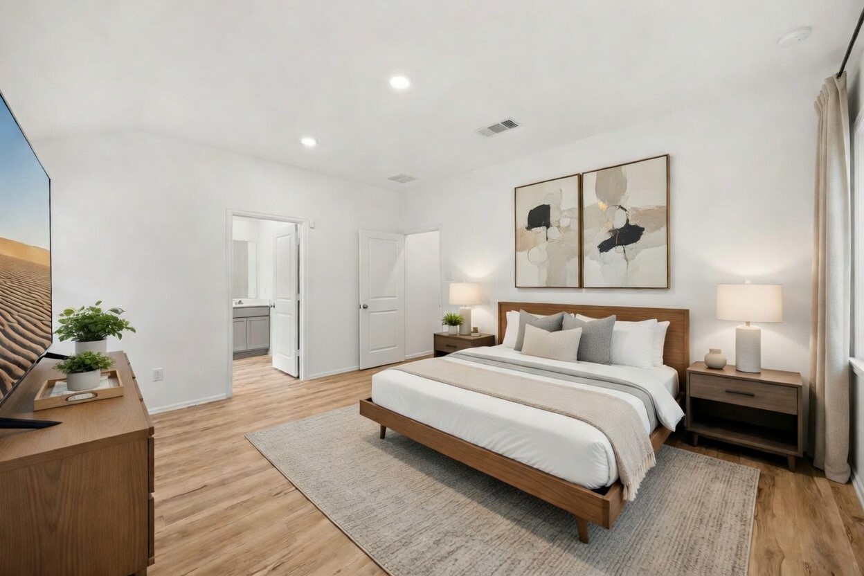 3014 Wedgewood Cove Way Porter, TX 77365 - Photo 12 of 24 a spacious bedroom with a bed and a couch