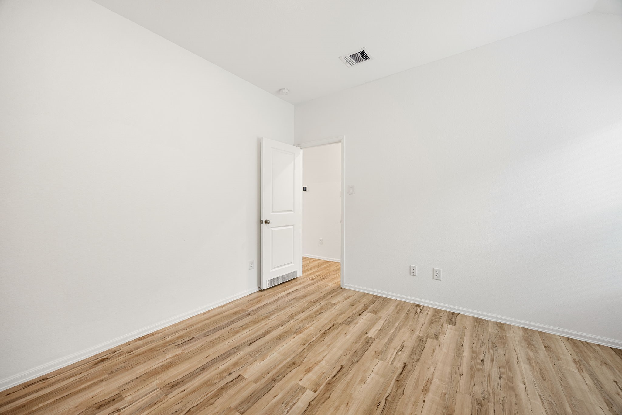 3014 Wedgewood Cove Way Porter, TX 77365 - Photo 18 of 24 a view of a room with wooden floor