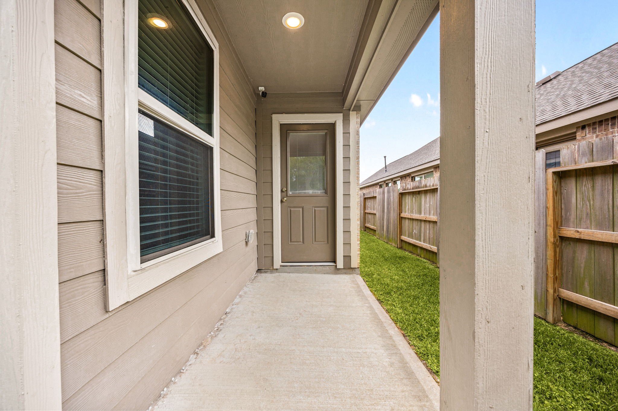 3014 Wedgewood Cove Way Porter, TX 77365 - Photo 22 of 24 a view of a house with a door and a window