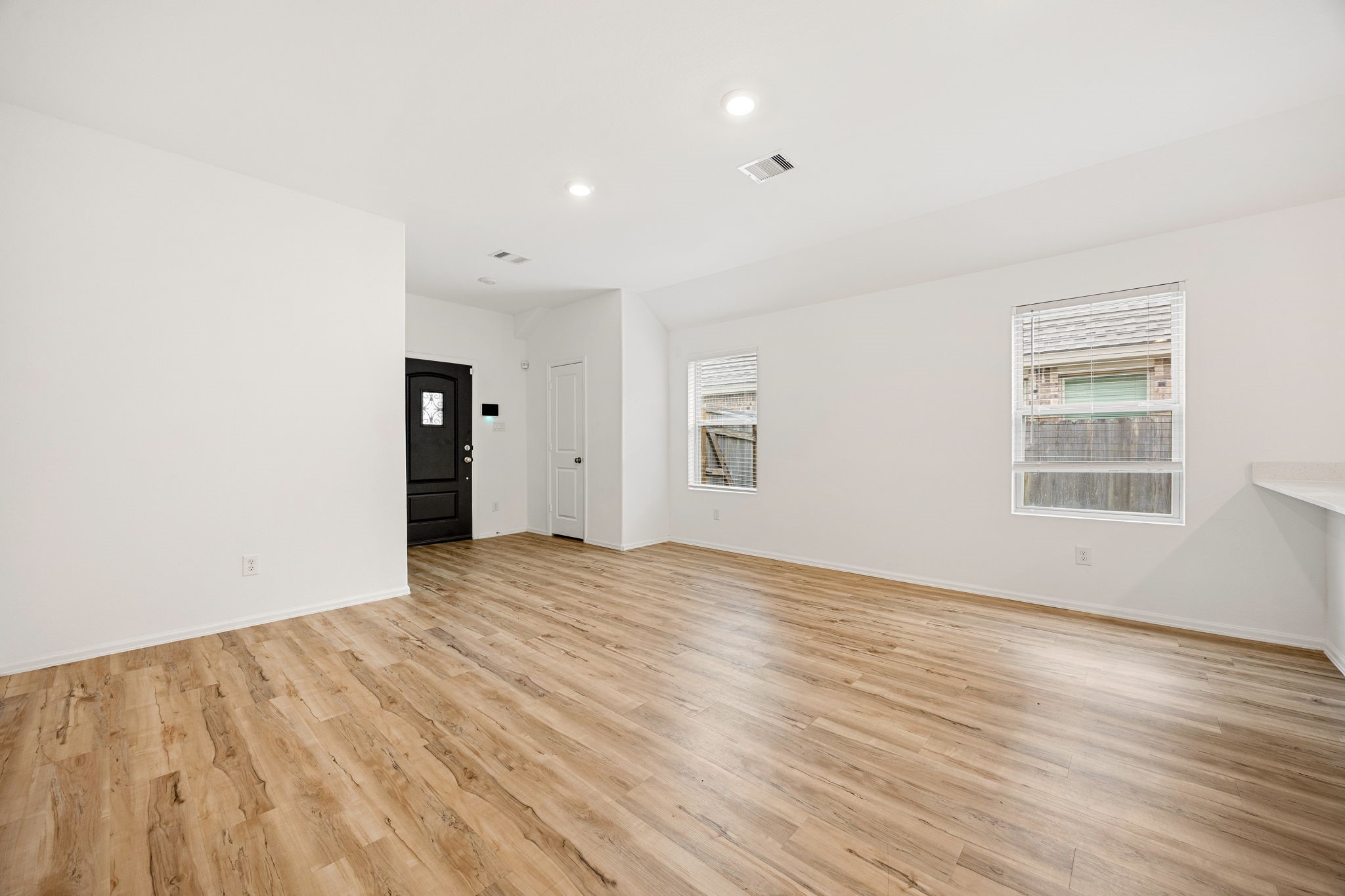 3014 Wedgewood Cove Way Porter, TX 77365 - Photo 7 of 24 an empty room with wooden floor and windows
