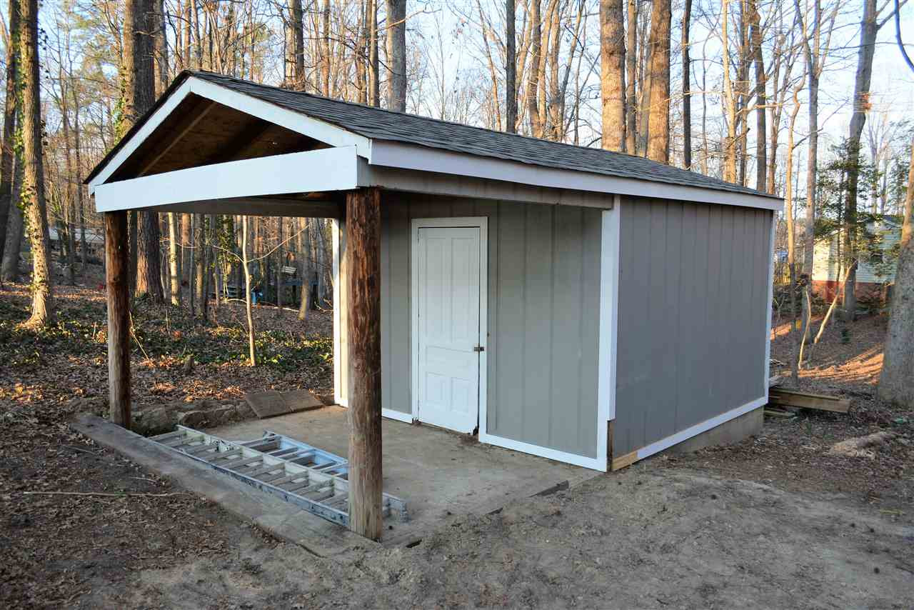 7249 Rock Service Station Road Raleigh, NC 27603 - Photo 24 of 25 Your updated Man Cave or potential She Shed-lots of bonus storage. Bonus storage building