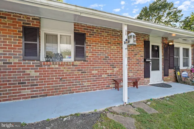 a view of house with backyard