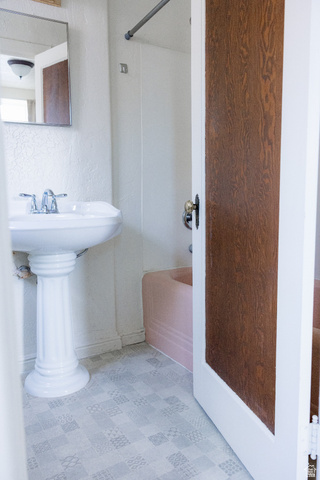 69 South Main Street Manti, UT 84642 - Photo 30 of 44 Bathroom featuring a pedestal sink, chrome faucet, wall-mounted mirror, and patterned floor tiles