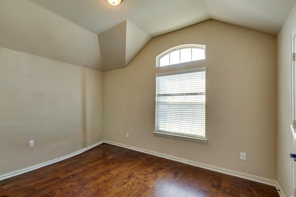 1522 Blue Jay Road Garland, TX 75043 - Photo 28 of 32 Room with wood-finish flooring, neutral wall tones, and white baseboards
