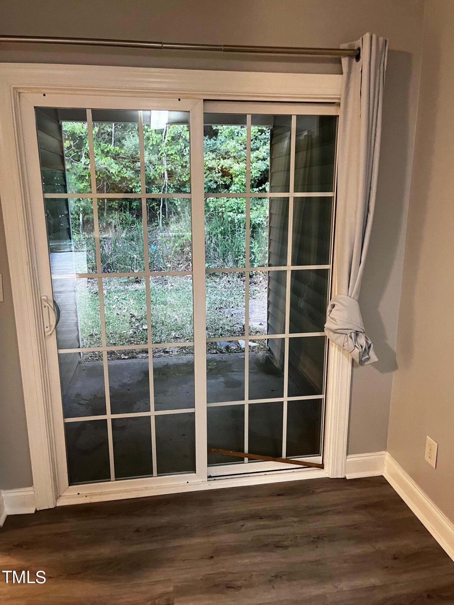 623 Rawls Drive Raleigh, NC 27610 - Photo 12 of 21 a view of empty room with wooden floor and windows