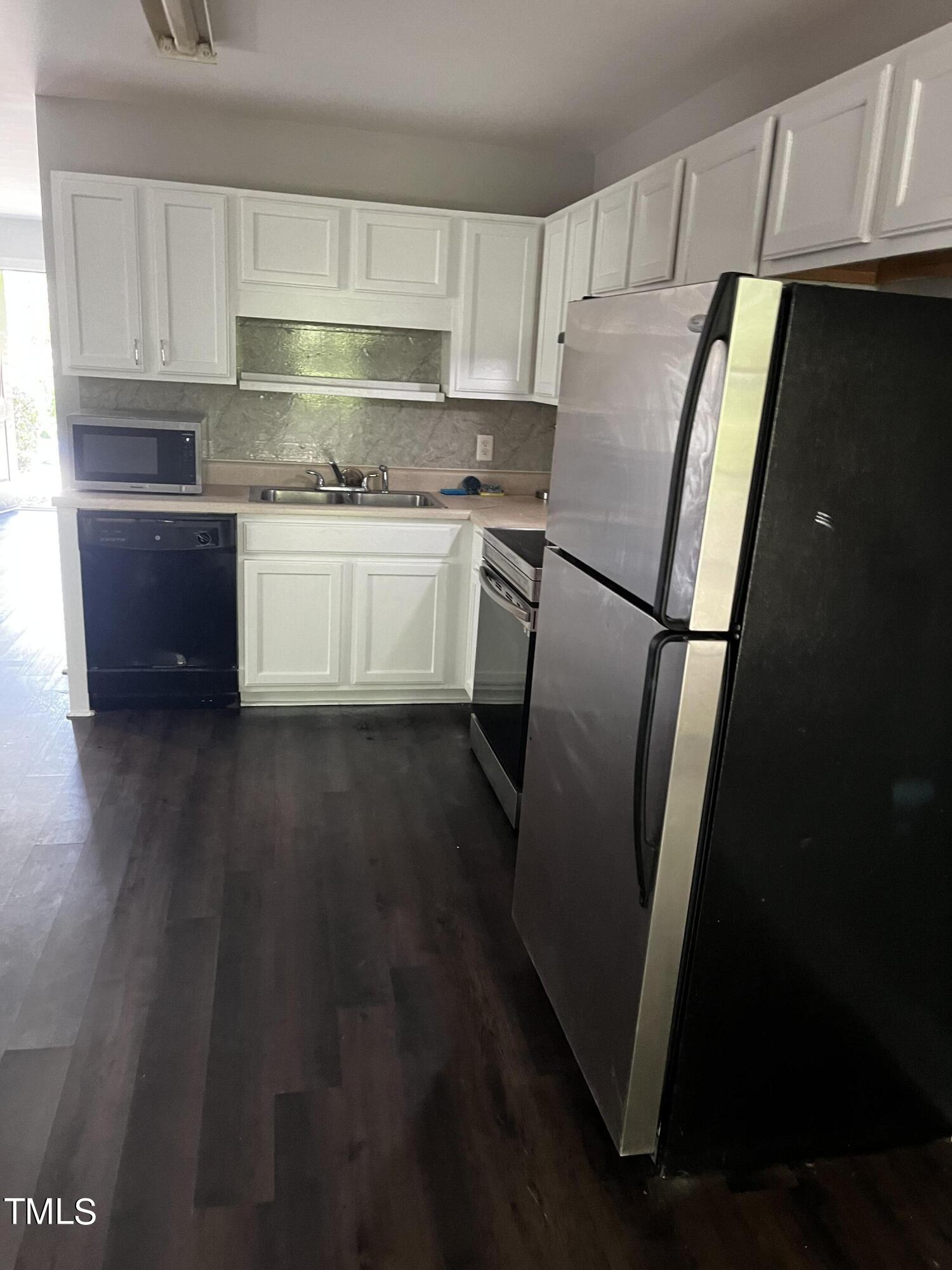623 Rawls Drive Raleigh, NC 27610 - Photo 15 of 21 a white refrigerator freezer sitting inside of a kitchen