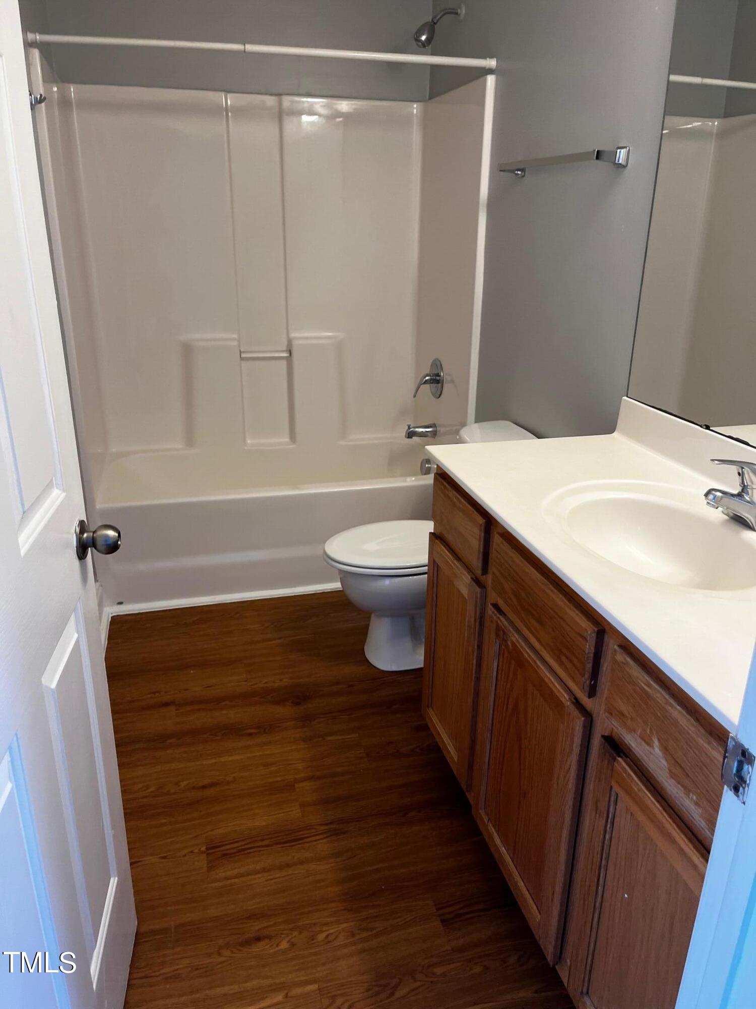 623 Rawls Drive Raleigh, NC 27610 - Photo 17 of 21 a bathroom with a sink a toilet and shower