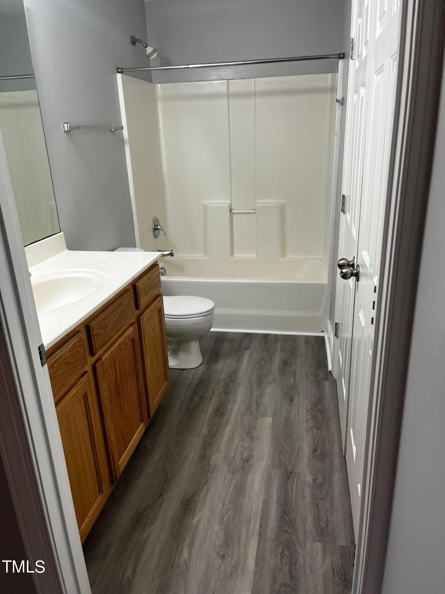 623 Rawls Drive Raleigh, NC 27610 - Photo 4 of 21 a bathroom with a granite countertop sink toilet and shower