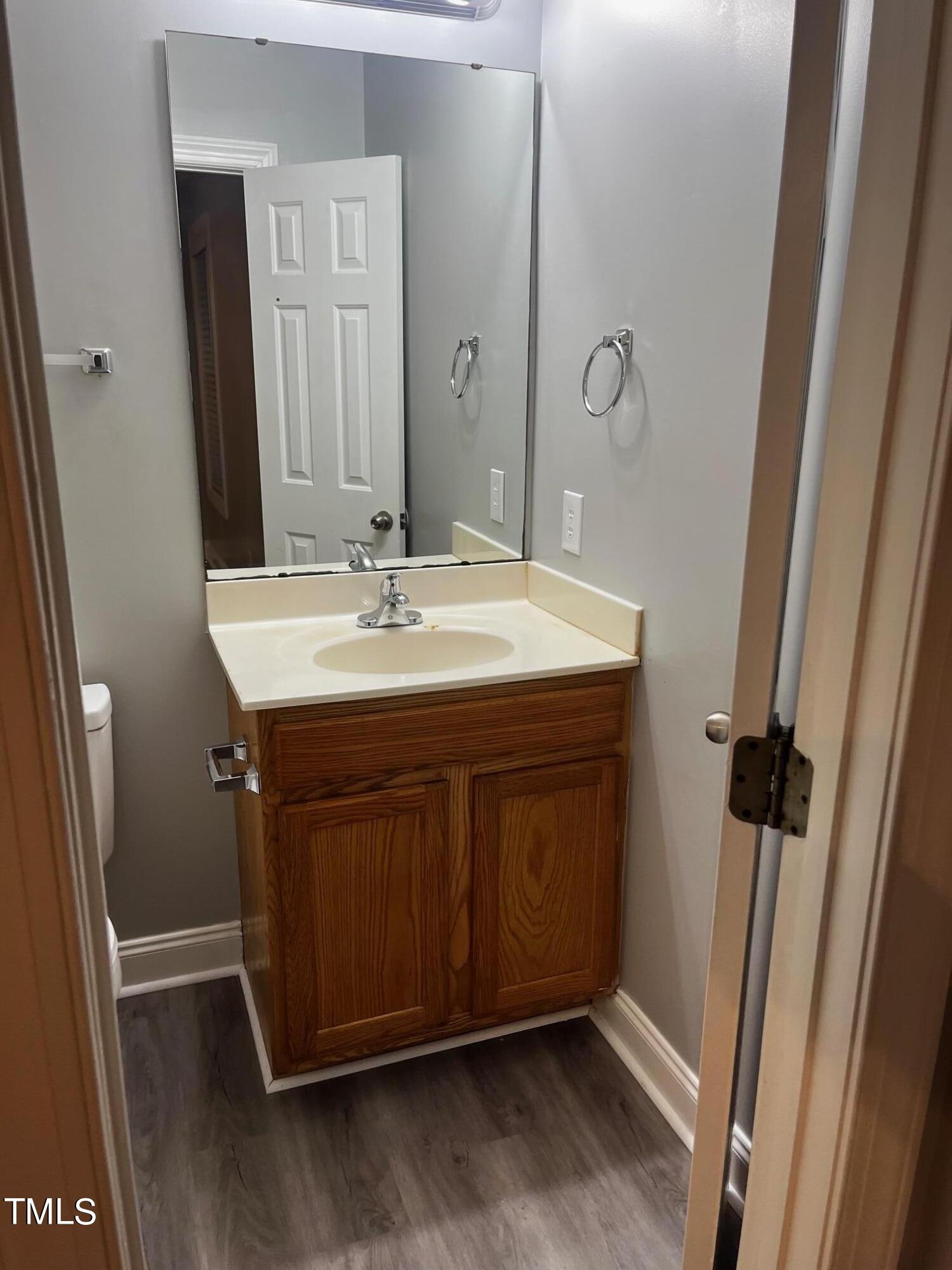 623 Rawls Drive Raleigh, NC 27610 - Photo 8 of 21 a bathroom with a sink a mirror and a shower