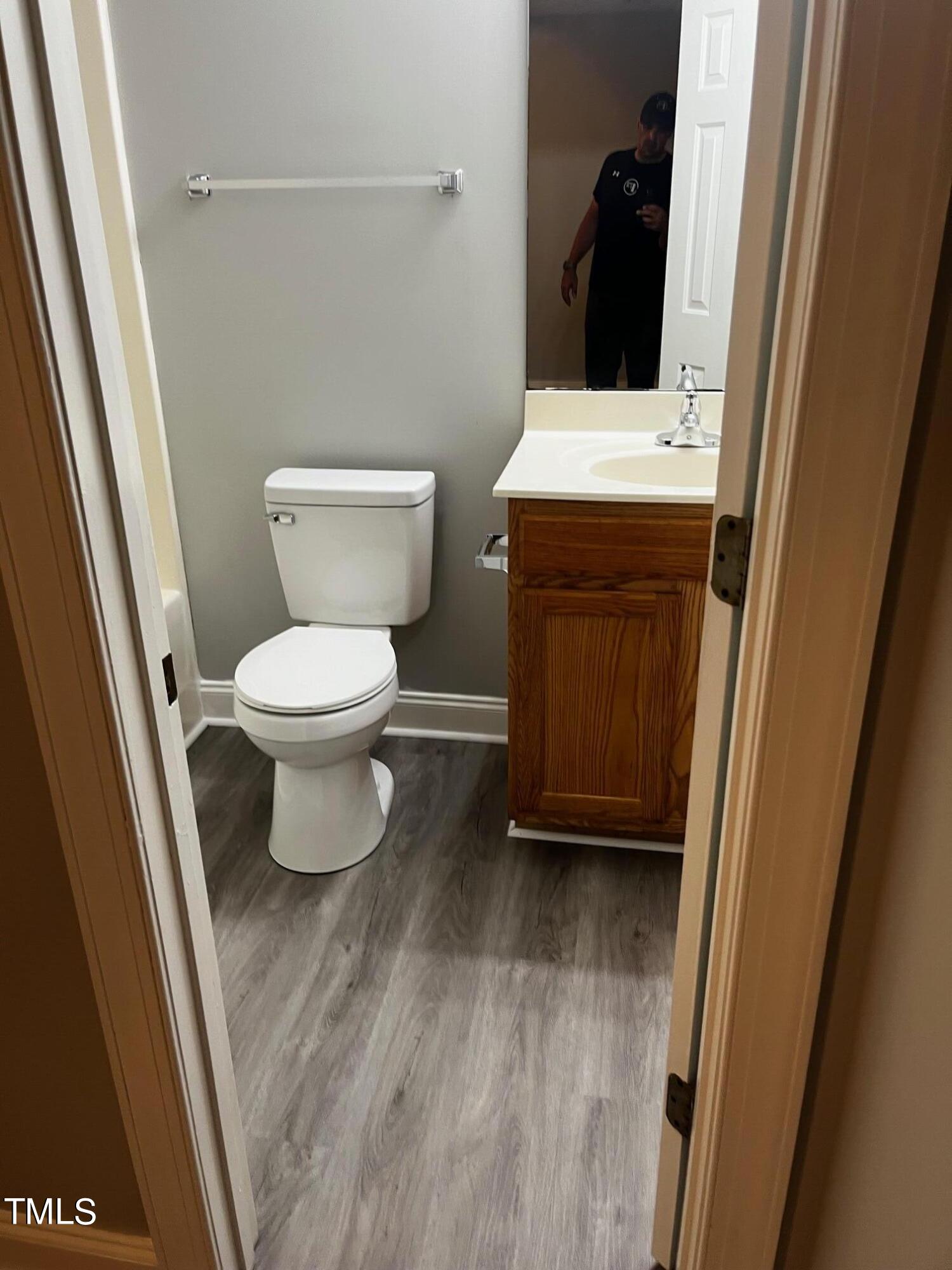 623 Rawls Drive Raleigh, NC 27610 - Photo 10 of 21 a bathroom with a toilet and a sink