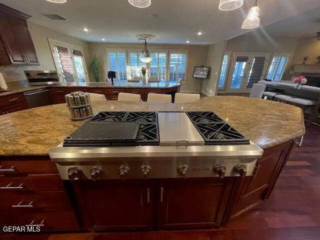 a stove top oven sitting inside of a kitchen