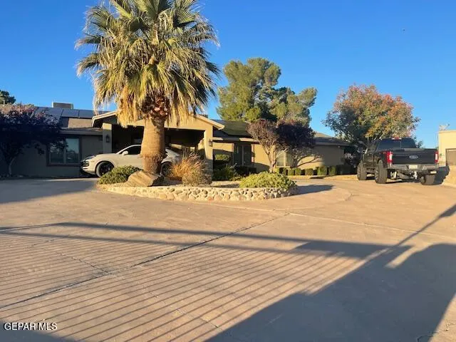 a view of a swimming pool with a house in the background