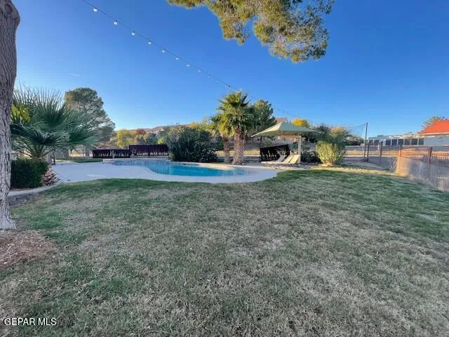 a view of a big yard with a house