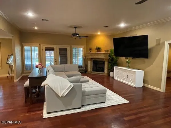 a living room with furniture and a flat screen tv