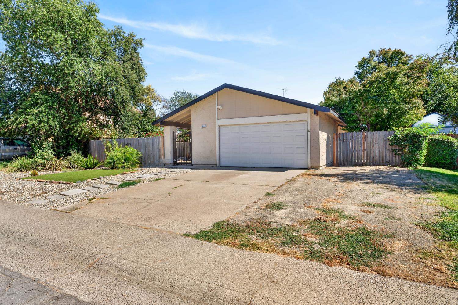 8488 Old Ranch Road Orangevale, CA 95662 - Photo 4 of 51 a front view of a house with a yard and garage