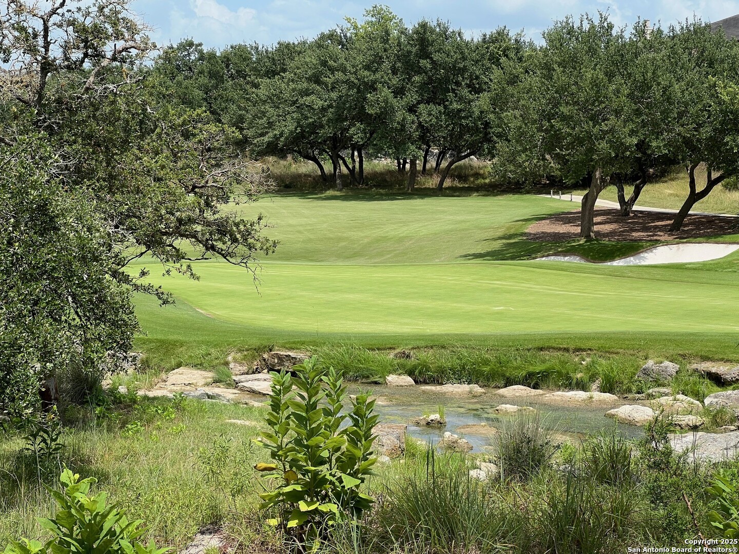 Lot 26 Winged Foot Boerne, TX 78006 - Photo 2 of 15 a view of a golf course with a lake