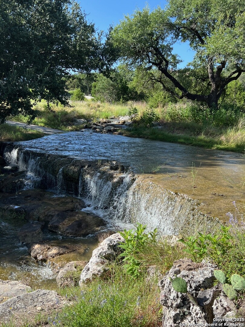 Lot 26 Winged Foot Boerne, TX 78006 - Photo 4 of 15 a view of a lake from a yard