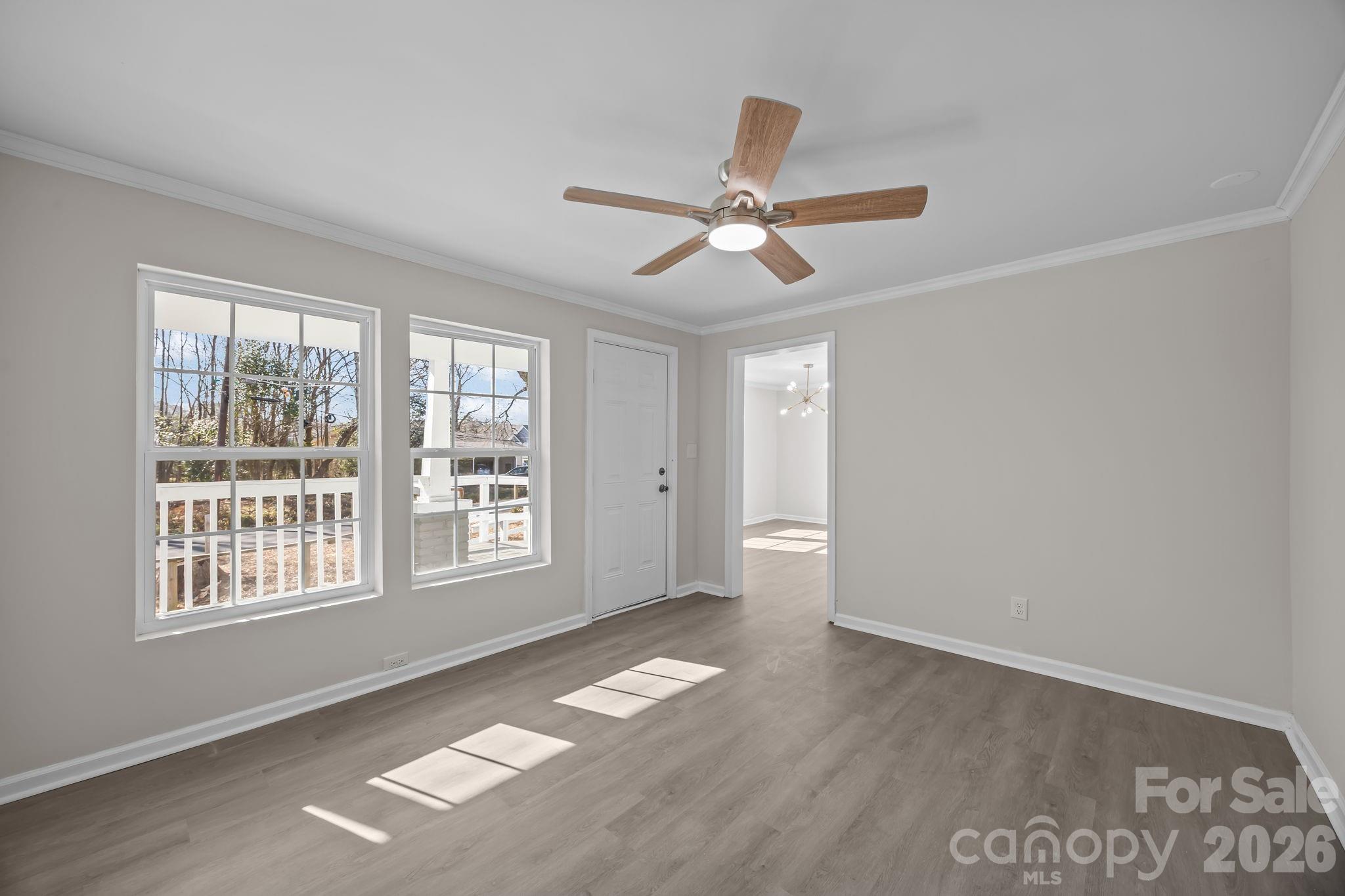 5010 Athens Street Kannapolis, NC 28081 - Photo 14 of 36 a view of empty room with wooden floor and fan