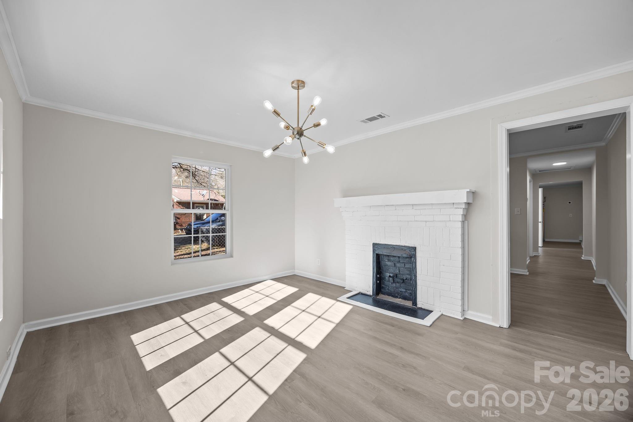 5010 Athens Street Kannapolis, NC 28081 - Photo 15 of 36 an empty room with windows and fireplace