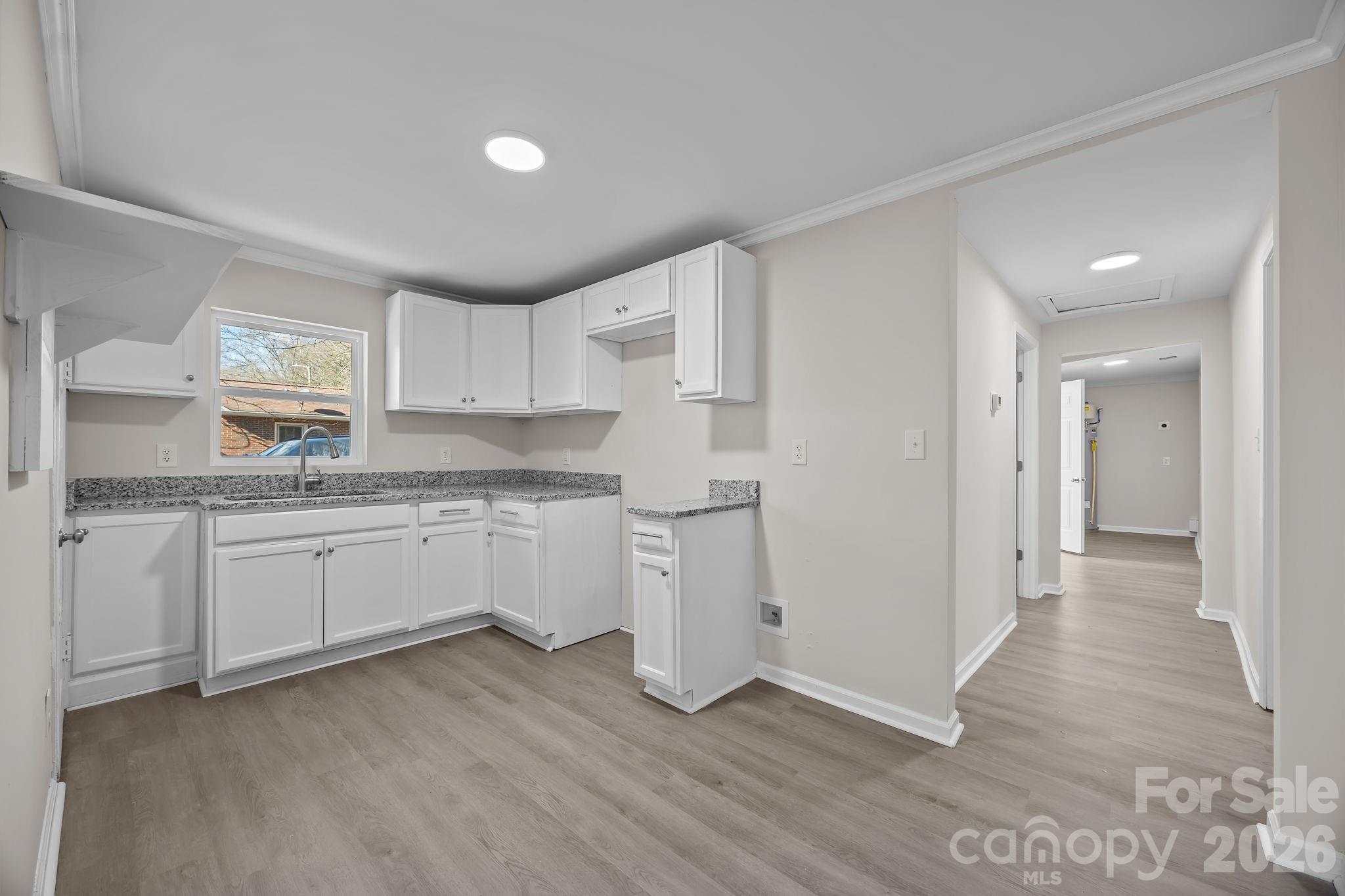 5010 Athens Street Kannapolis, NC 28081 - Photo 17 of 36 a kitchen with a refrigerator sink and cabinets