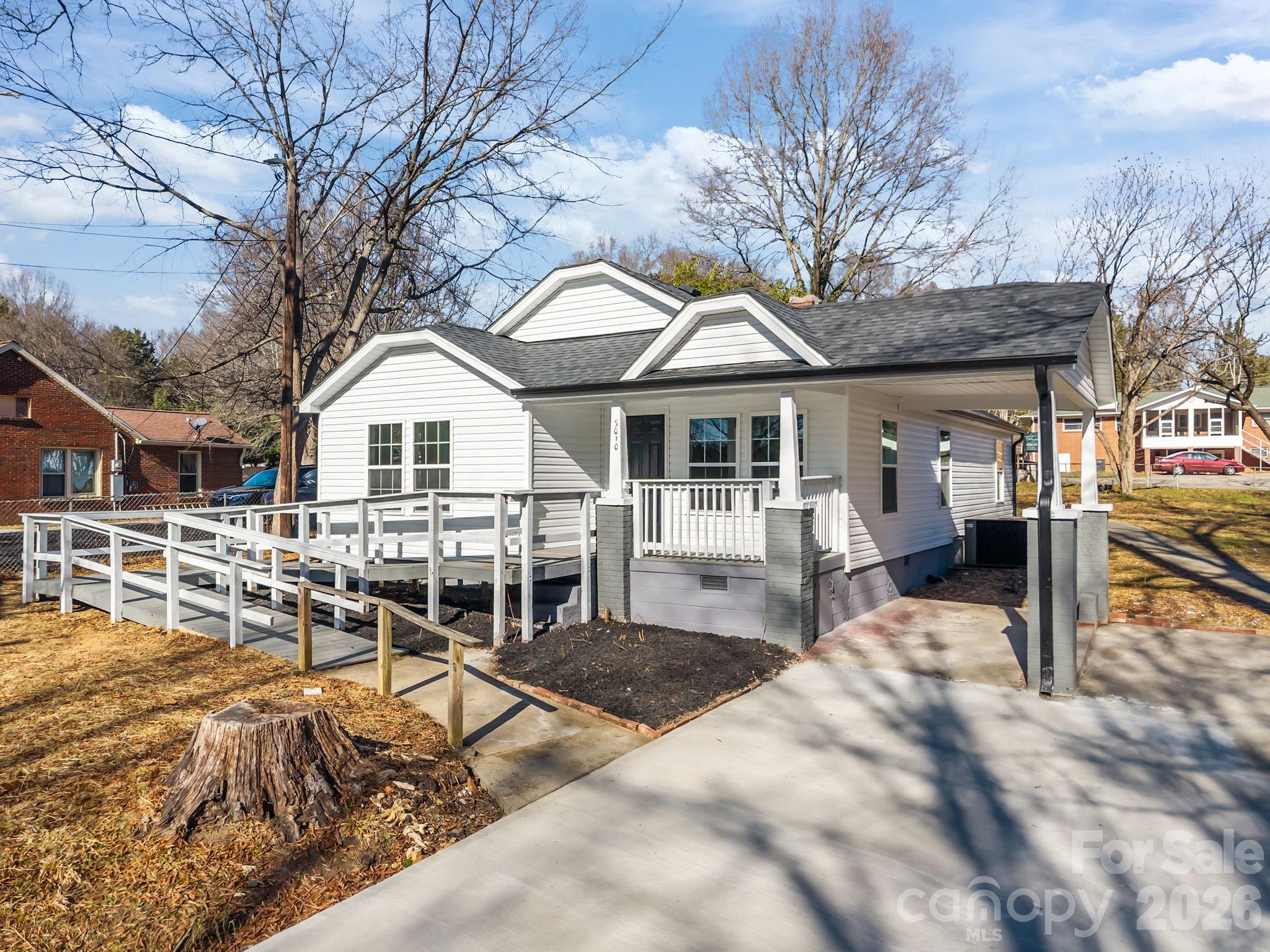 5010 Athens Street Kannapolis, NC 28081 - Photo 6 of 36 a view of a house with backyard porch and sitting area