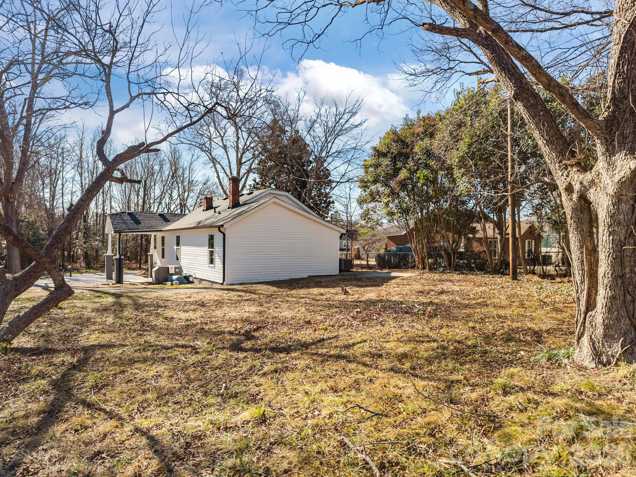 5010 Athens Street Kannapolis, NC 28081 - Photo 10 of 36 a big house with trees in front of it
