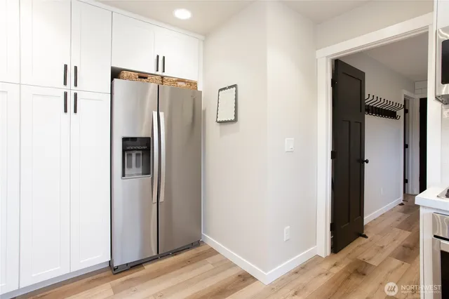 a view of hallway with wooden floor