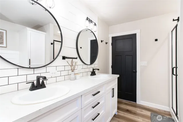 a bathroom with a sink and a mirror