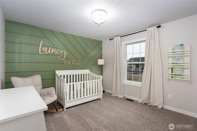 a view of a room that has a bed and a window