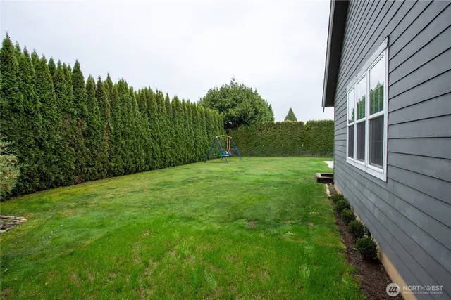 a path view of a house with a street